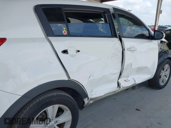 2013 Kia Sportage LX z VIN KNDPB3A2XD7521010, wystawiony jako IAAI lot #42297975 z przebiegiem 134 826 mil mil oraz . Historia ofert i sprzedaży dostępna na DreamBid. Obrazek 6.