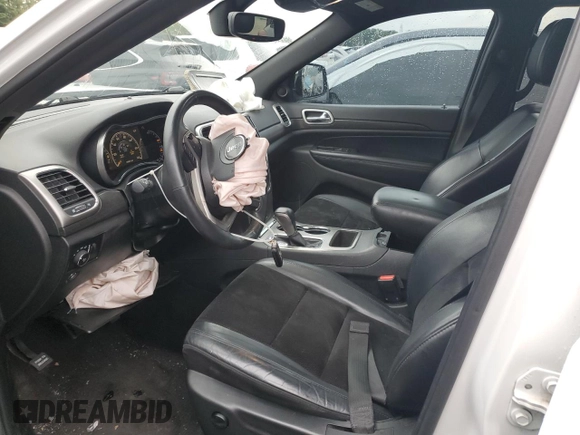 2018 Jeep Grand Cherokee Altitude with VIN 1C4RJFAGXJC122688, listed as a Copart auction lot 61290525 with 106,671 mi miles and Salvage title. Bid and sale history available at DreamBid. Image 7.