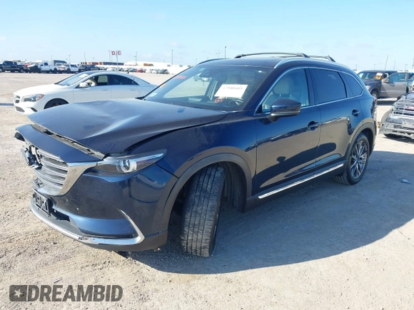 2016 Mazda CX-9 Grand Touring with VIN JM3TCADY6G0107064, listed as a IAAI auction lot 42580485 with 124,713 mi miles and . Bid and sale history available at DreamBid. Image 2.