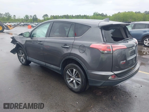 2018 Toyota RAV4 XLE with VIN 2T3RFREV5JW701564, listed as a IAAI auction lot 41976067 with 128,404 mi miles. Bid and sale history available at carsss.com. Image 3.