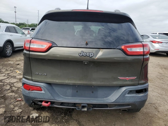 2015 Jeep Cherokee Trailhawk with VIN 1C4PJMBSXFW545534, listed as a Copart auction lot 62236885 with 148,448 mi miles and Clean title. Bid and sale history available at DreamBid. Image 6.