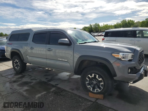 2020 Toyota Tacoma SR5 with VIN 3TMDZ5BN6LM097302, listed as a Copart auction lot 57503895 with 77,212 mi miles and Salvage title. Bid and sale history available at DreamBid. Image 4.
