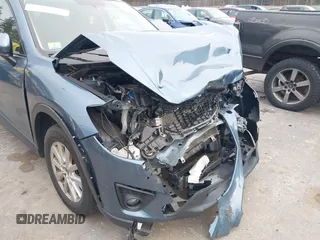 2015 Mazda CX-5 Touring with VIN JM3KE4CY1F0545305, listed as a IAAI auction lot 41234599 with 92,791 mi miles. Bid and sale history available at carsss.com. Image 18.
