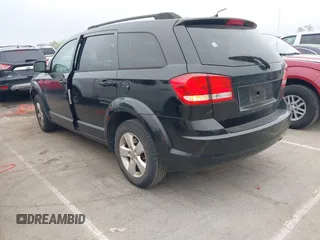 2014 Dodge Journey SE with VIN 3C4PDCAB0ET116863, listed as a IAAI auction lot 41950773 with 183,866 mi miles. Bid and sale history available at carsss.com. Image 3.