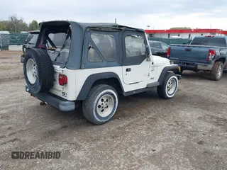 1998 Jeep Wrangler Sport with VIN 1J4FY19S0WP779147, listed as a IAAI auction lot 42045723 with 205,822 mi miles. Bid and sale history available at carsss.com. Image 4.