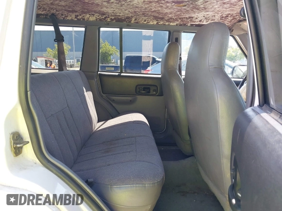 1998 Jeep Cherokee Sport with VIN 1J4FJ68S4WL227094, listed as a IAAI auction lot 42361950 with Not provided miles and . Bid and sale history available at DreamBid. Image 8.