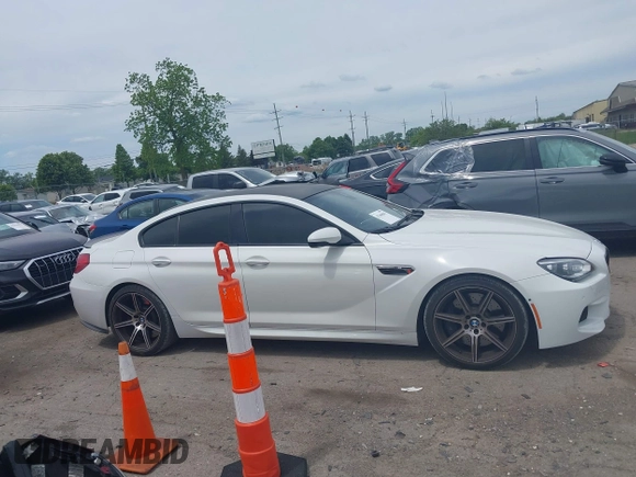 2015 BMW M6 z VIN WBS6C9C50FD467538, wystawiony jako IAAI lot #42366043 z przebiegiem 66 379 mil mil oraz . Historia ofert i sprzedaży dostępna na DreamBid. Obrazek 13.