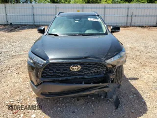 2023 Toyota Corolla Cross LE with VIN 7MUCAAAG3PV058094, listed as a Copart auction lot 57983105 with 30,593 mi miles and Salvage title. Bid and sale history available at DreamBid. Image 5.