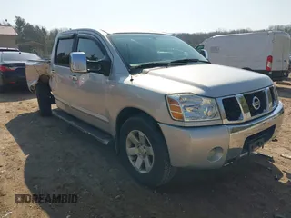 2004 Nissan Titan LE with VIN 1N6AA07B44N573319, listed as a IAAI auction lot 42004100 with 196,357 mi miles. Bid and sale history available at carsss.com. Image 1.