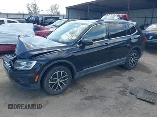2021 Volkswagen Tiguan SE with VIN 3VV3B7AX3MM157702, listed as a IAAI auction lot 41888479 with 51,807 mi miles and . Bid and sale history available at DreamBid. Image 2.