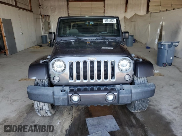 2017 Jeep Wrangler Sahara z VIN 1C4AJWBG6HL582839, wystawiony jako Copart lot #52049725 z przebiegiem 143 544 mil mil oraz Szkoda całkowita • Salvage title. Historia ofert i sprzedaży dostępna na DreamBid. Obrazek 5.