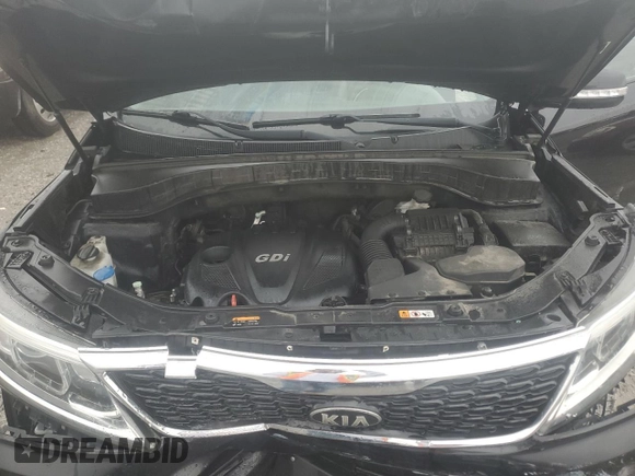2015 Kia Sorento LX z VIN 5XYKTCA64FG636749, wystawiony jako Copart lot #54692105 z przebiegiem 141 739 mil mil oraz Szkoda całkowita • Salvage title. Historia ofert i sprzedaży dostępna na DreamBid. Obrazek 12.