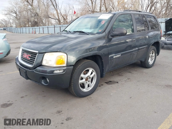 2005 GMC Envoy SLT with VIN 1GKDT13S352258833, listed as a IAAI auction lot 41525149 with 213,829 mi miles. Bid and sale history available at carsss.com. Image 2.