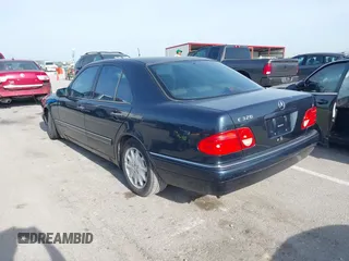 1997 Mercedes-Benz E-Class with VIN WDBJF55F7VJ027080, listed as a IAAI auction lot 42120838 with 150,197 mi miles. Bid and sale history available at carsss.com. Image 3.