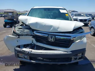 2019 Honda Ridgeline RTL-E with VIN 5FPYK3F74KB009279, listed as a IAAI auction lot 42348773 with 98,141 mi miles and . Bid and sale history available at DreamBid. Image 12.