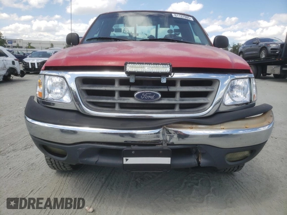 2000 Ford F-150 XL with VIN 1FTZF1824YNB06211, listed as a Copart auction lot 61137885 with 199,934 mi miles and Salvage title. Bid and sale history available at DreamBid. Image 5.