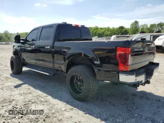 2021 Ford Super Duty F-250 SRW XL with VIN 1FT7W2BT1MEC51277, listed as a Copart auction lot 54199165 with 99,324 mi miles and Salvage Title. Bid and sale history available at carsss.com. Image 2.