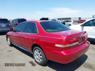 2002 Honda Accord SE z VIN 1HGCG56742A087457, wystawiony jako IAAI lot #42397581 z przebiegiem 187 534 mil mil oraz . Historia ofert i sprzedaży dostępna na DreamBid. Obrazek 3.
