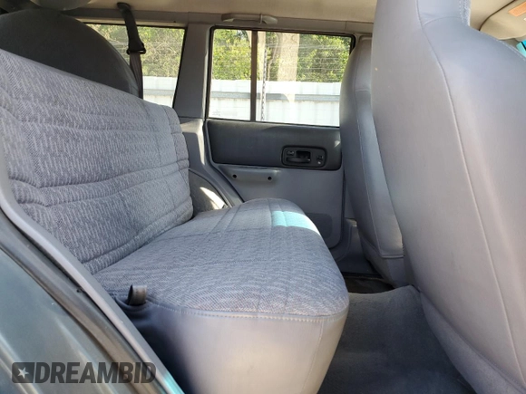 1998 Jeep Cherokee Sport with VIN 1J4FJ68S6WL283022, listed as a Copart auction lot 57451125 with 207,618 mi miles and Salvage title. Bid and sale history available at DreamBid. Image 11.