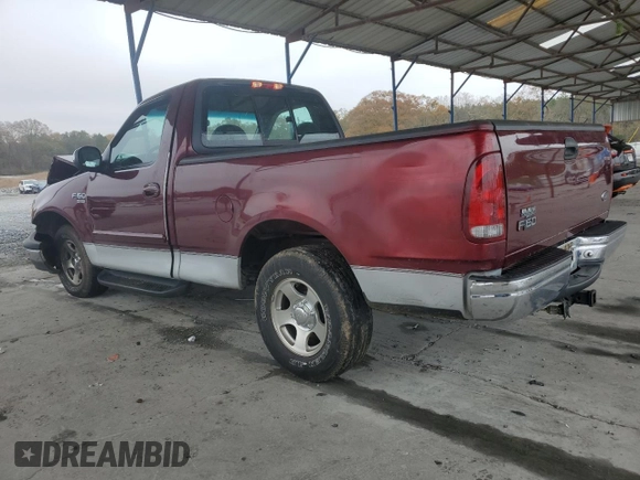 1999 Ford F-150 XL with VIN 2FTRF17L0XCB19827, listed as a Copart auction lot 85282164 with 52,103 mi miles and Salvage title. Bid and sale history available at DreamBid. Image 2.