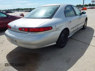 1998 Mercury Sable GS z VIN 1MEFM50U2WG637727, wystawiony jako IAAI lot #42316281 z przebiegiem 195 706 mil mil oraz . Historia ofert i sprzedaży dostępna na DreamBid. Obrazek 4.