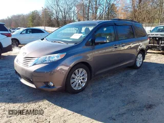 2011 Toyota Sienna XLE with VIN 5TDDK3DC8BS009739, listed as a IAAI auction lot 41638710 with 235,396 mi miles. Bid and sale history available at carsss.com. Image 2.