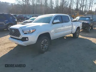 2021 Toyota Tacoma 4WD SR5 with VIN 3TYDZ5BN3MT001860, listed as a IAAI auction lot 41269423 with 23,378 mi miles. Bid and sale history available at carsss.com. Image 2.