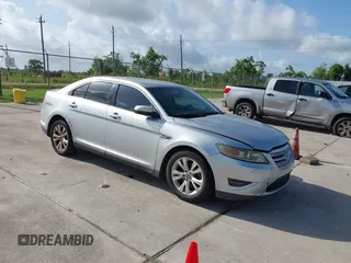 2012 Ford Taurus SEL z VIN 1FAHP2EWXCG136371, wystawiony jako IAAI lot #42455393 z przebiegiem 188 134 mil mil oraz . Historia ofert i sprzedaży dostępna na DreamBid. Obrazek 1.