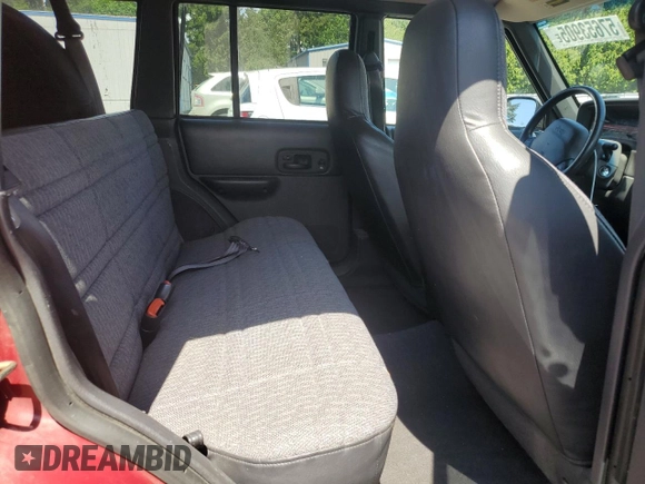 1999 Jeep Cherokee Sport z VIN 1J4FF68SXXL525944, wystawiony jako Copart lot #57653905 z przebiegiem 102 057 mil mil oraz Szkoda całkowita • Salvage title. Historia ofert i sprzedaży dostępna na DreamBid. Obrazek 11.