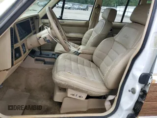 1990 Jeep Grand Wagoneer z VIN 1J4FN78L0LL282169, wystawiony jako Copart lot #59809545 z przebiegiem 194 382 mil mil oraz Czysty tytuł • Clean title. Historia ofert i sprzedaży dostępna na DreamBid. Obrazek 7.