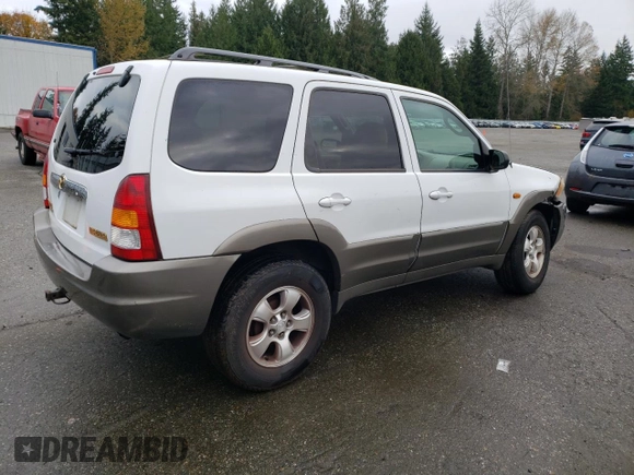 2001 Mazda Tribute LX with VIN 4F2CU08101KM11452, listed as a Copart auction lot 76796064 with 175,584 mi miles and Salvage Title. Bid and sale history available at DreamBid. Image 3.