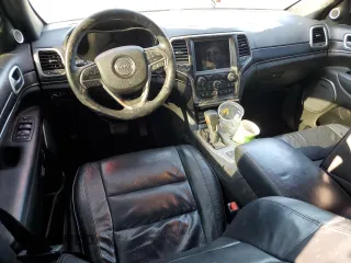 2018 Jeep Grand Cherokee High Altitude with VIN 1C4RJFCG3JC488022, listed as a Copart auction lot 87700385 with 94,390 mi miles and Salvage title. Bid and sale history available at DreamBid. Image 8.