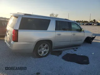 2020 Chevrolet Suburban Premier with VIN 1GNSCJKC9LR198484, listed as a Copart auction lot 87354514 with 115,008 mi miles and Salvage title. Bid and sale history available at DreamBid. Image 3.