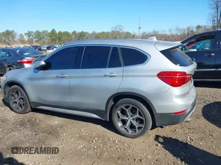 2018 BMW X1 xDrive28i with VIN WBXHT3C30J5L29757, listed as a IAAI auction lot 41879504 with 60,490 mi miles. Bid and sale history available at carsss.com. Image 14.