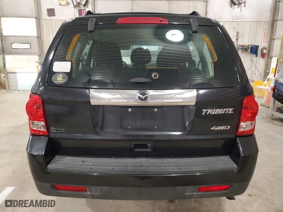 2011 Mazda Tribute Sport with VIN 4F2CY9C74BKM06583, listed as a Copart auction lot 49599745 with 153,464 mi miles and Salvage Title. Bid and sale history available at carsss.com. Image 6.