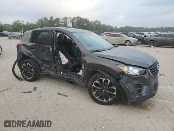 2016 Mazda CX-5 Grand Touring with VIN JM3KE4DY5G0865923, listed as a Copart auction lot 51637115 with 151,174 mi miles and Salvage Title. Bid and sale history available at carsss.com. Image 4.
