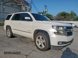 2015 Chevrolet Tahoe LT with VIN 1GNSCBKC1FR714895, listed as a Copart auction lot 60787185 with 239,815 mi miles and Salvage title. Bid and sale history available at DreamBid. Image 4.
