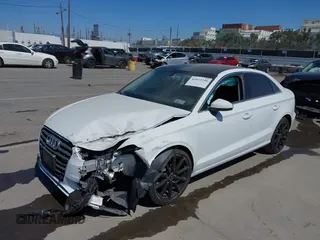 2016 Audi A3 1.8T Premium Plus with VIN WAUC7GFF1G1060500, listed as a IAAI auction lot 41823246 with 1 mi miles. Bid and sale history available at carsss.com. Image 2.
