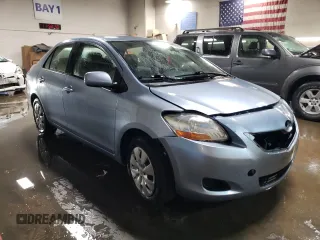 2010 Toyota Yaris with VIN JTDBT4K35A4064446, listed as a Copart auction lot 52099855 with 61,934 mi miles and Salvage Title. Bid and sale history available at carsss.com. Image 4.