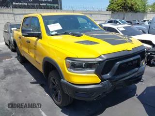 2023 Ram 1500 Rebel z VIN 1C6SRFLT3PN687390, wystawiony jako IAAI lot #42224542 z przebiegiem 7 002 mil mil oraz . Historia ofert i sprzedaży dostępna na DreamBid. Obrazek 1.