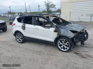 2015 Ford Escape Titanium with VIN 1FMCU0JX1FUB05026, listed as a IAAI auction lot 41663887 with 1 mi miles. Bid and sale history available at carsss.com. Image 1.