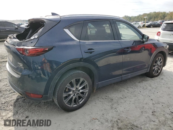 2021 Mazda CX-5 Signature with VIN JM3KFBEY3M0439658, listed as a Copart auction lot 74534464 with 50,816 mi miles and Salvage Title. Bid and sale history available at carsss.com. Image 3.
