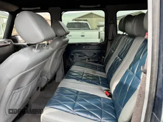 2003 Mercedes-Benz G 500 z VIN WDCYR49E73X137599, wystawiony jako Copart lot #56765315 z przebiegiem 157 409 mil mil oraz Tytuł czysty. Historia ofert i sprzedaży dostępna na DreamBid. Obrazek 6.