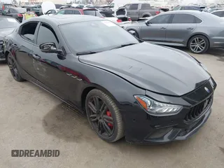 2021 Maserati Ghibli S with VIN ZAM57YSA3M1365483, listed as a IAAI auction lot 42562390 with 51,954 mi miles and . Bid and sale history available at DreamBid. Image 1.