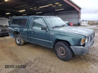 1995 Mitsubishi Mighty Max z VIN JA7LS21G4SP000718, wystawiony jako Copart lot #83634734 z przebiegiem 129 382 mil mil oraz Szkody całkowita. Historia ofert i sprzedaży dostępna na DreamBid. Obrazek 4.