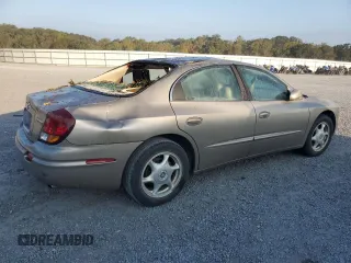 2003 Oldsmobile Aurora z VIN 1G3GS64C434101104, wystawiony jako Copart lot #74995974 z przebiegiem Nie podano mil oraz Szkody całkowita. Historia ofert i sprzedaży dostępna na DreamBid. Obrazek 3.