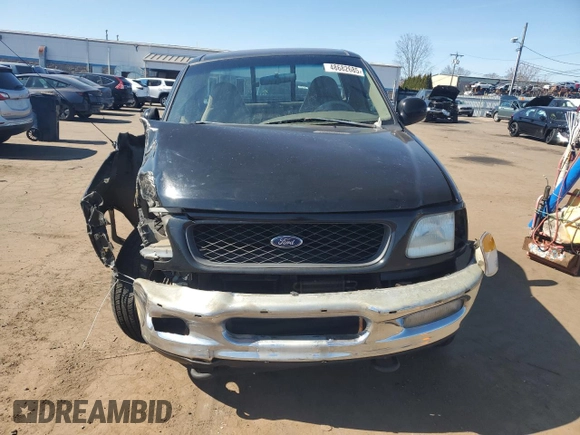 1998 Ford F-150 with VIN 1FTRF18L7WNA73159, listed as a Copart auction lot 48682685 with 71,261 mi miles and Salvage title. Bid and sale history available at DreamBid. Image 5.