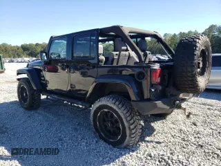 2007 Jeep Wrangler Unlimited Sahara with VIN 1J4GA59197L141821, listed as a Copart auction lot 76897044 with 124,070 mi miles and Salvage title. Bid and sale history available at DreamBid. Image 2.