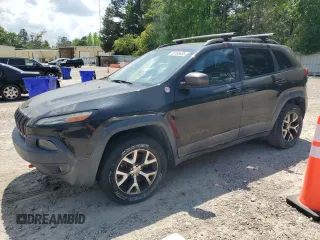 2014 Jeep Cherokee Trailhawk with VIN 1C4PJMBS1EW242527, listed as a Copart auction lot 53160485 with 104,074 mi miles and Salvage Title. Bid and sale history available at carsss.com. Image 1.
