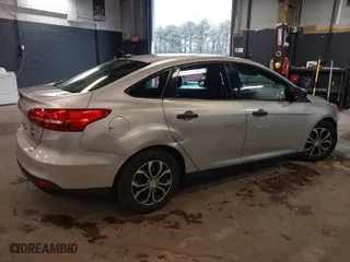 2016 Ford Focus S with VIN 1FADP3E22GL390039, listed as a IAAI auction lot 41958137 with 83,411 mi miles. Bid and sale history available at carsss.com. Image 4.